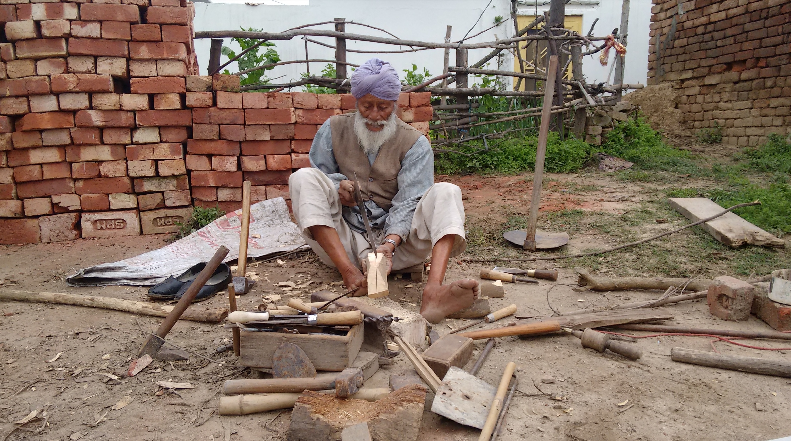 Dadaji doing working on the carpentry