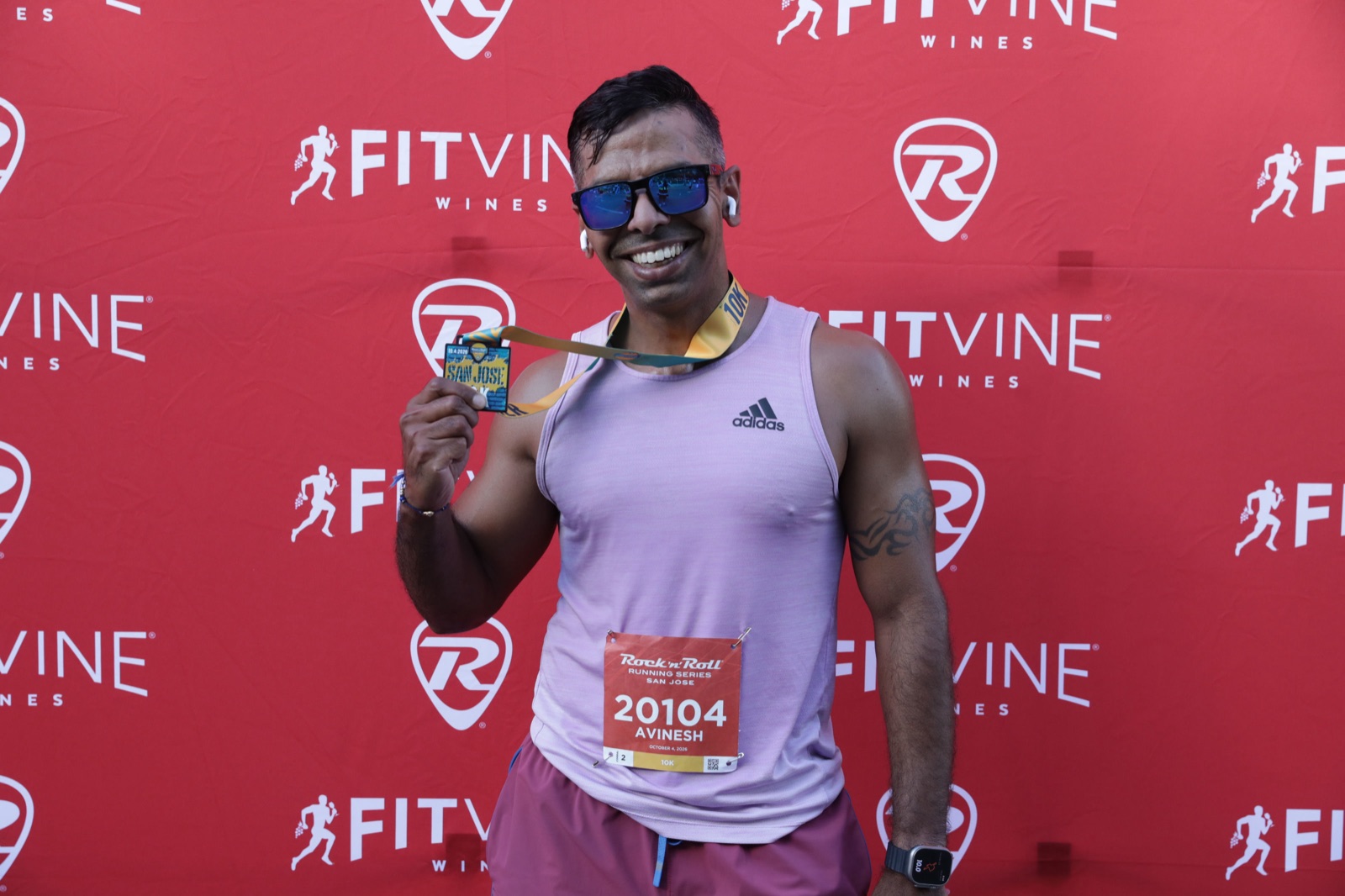 Rock 'n' Roll San Jose 10K 2026 — holding up the finisher medal